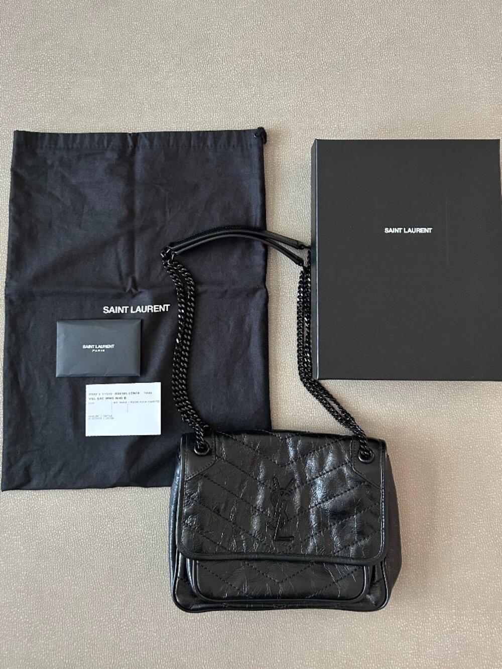Saint Laurent Niki Baby in Black Vintage Calf Leather